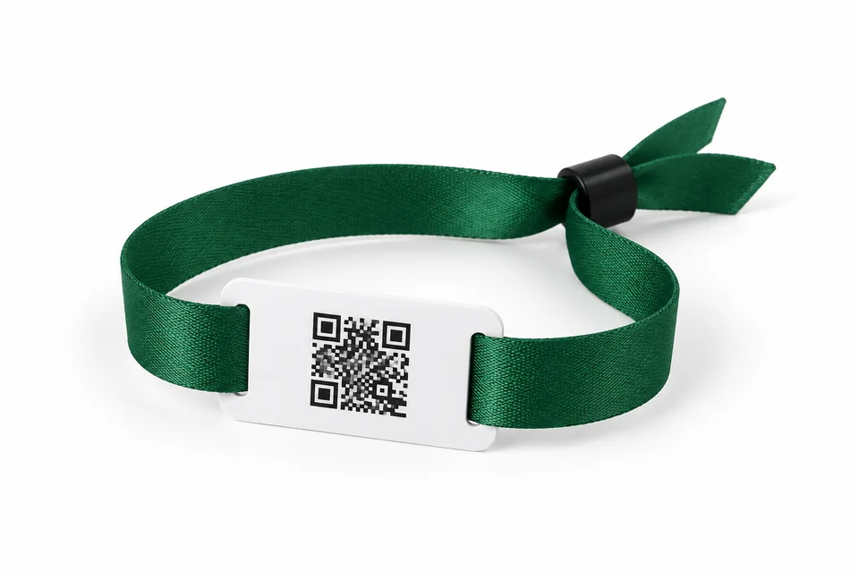 Green fabric wristband with a flat white rectangular NFC tag